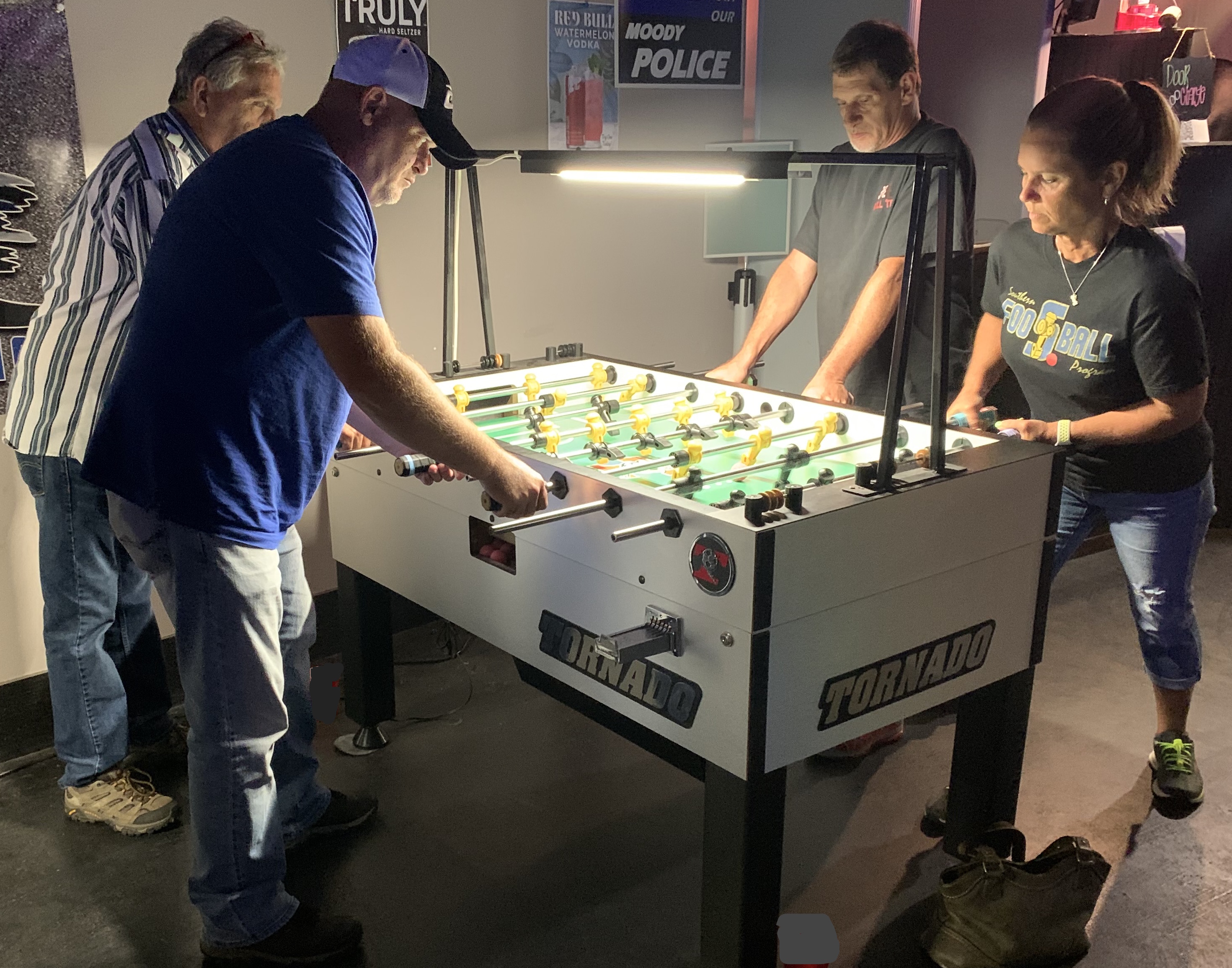 Pictured is Steve Dodgen & Ken Williams vs Randy Strickland & Cheryl Lowe during 2021 foosball tournament action at Vans Bar in Leeds, Alabama.